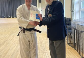 Steve receives his 2nd Dan award from Sensei Reg